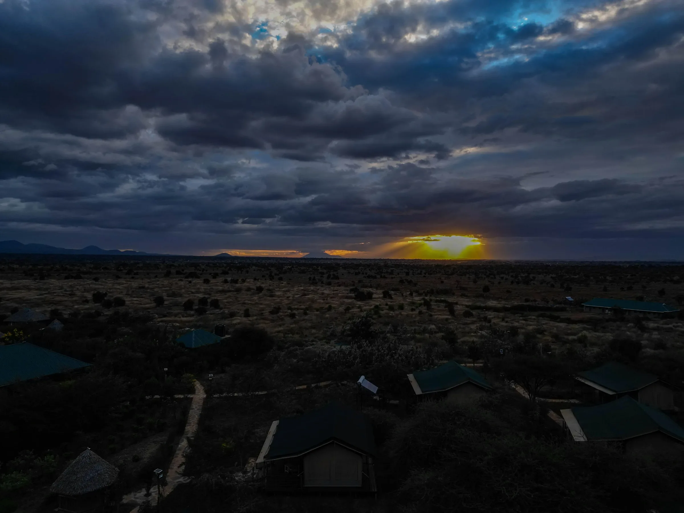 Sungura Safari Camp — aerial view of the camp at dusk on the Amboseli plains